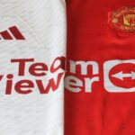 Dinâmicas Premier League — Close-up of Manchester United 2023 jerseys showcasing red and white designs.