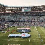 futebol argentino — Captivating view of a soccer match at Munich's iconic Allianz Arena, filled with excited fans.