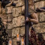 sexta-feira santa sem missa — A dramatic depiction of a religious Easter procession in Seville, showcasing sculptures and crucifixion scenes.