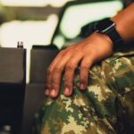 forças armadas na amazônia — Close-up of military personnel in camouflage inside an armored vehicle.